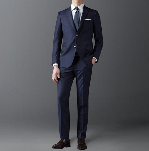 What fabrics are generally used for high-end suits?